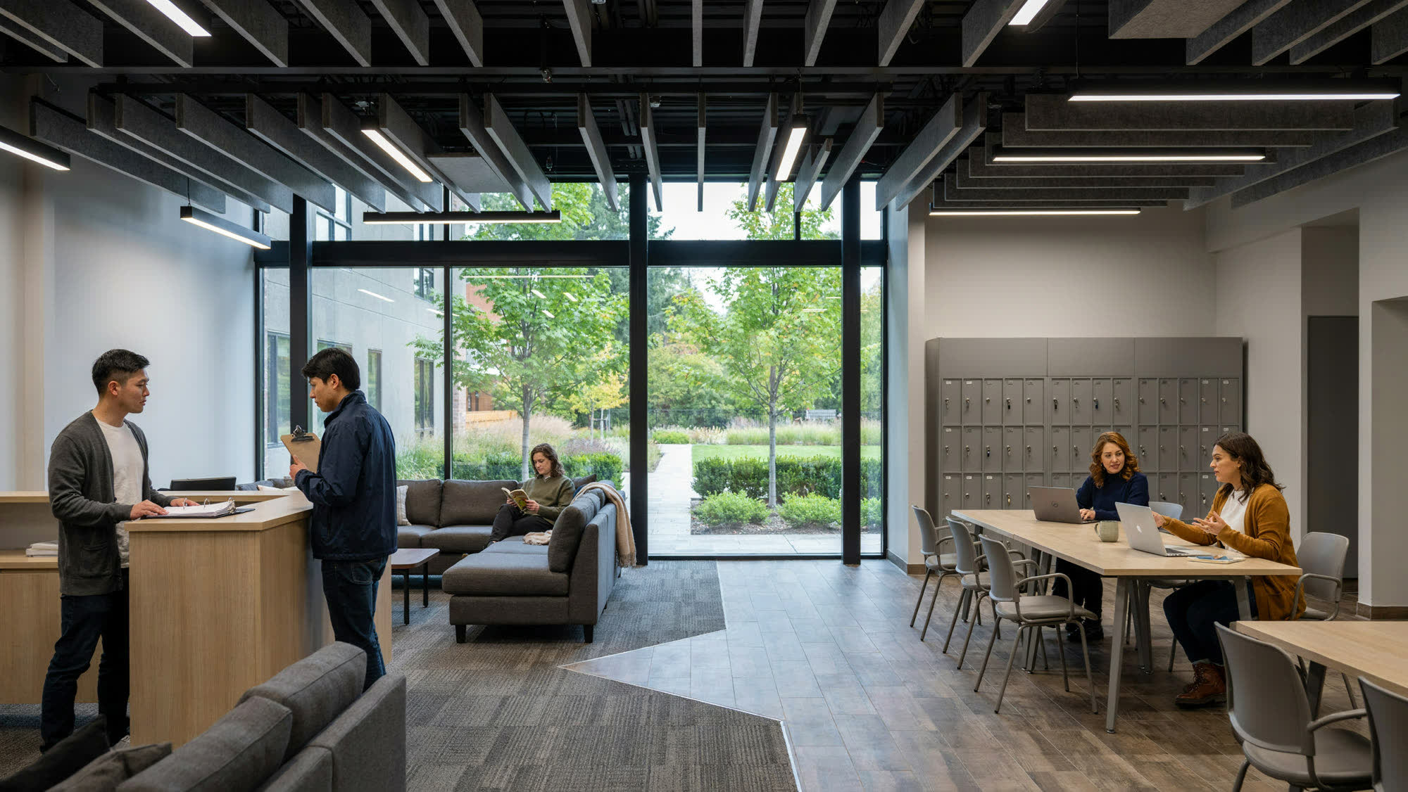 An apartment community clubhouse with shared lounge seating and a leasing desk