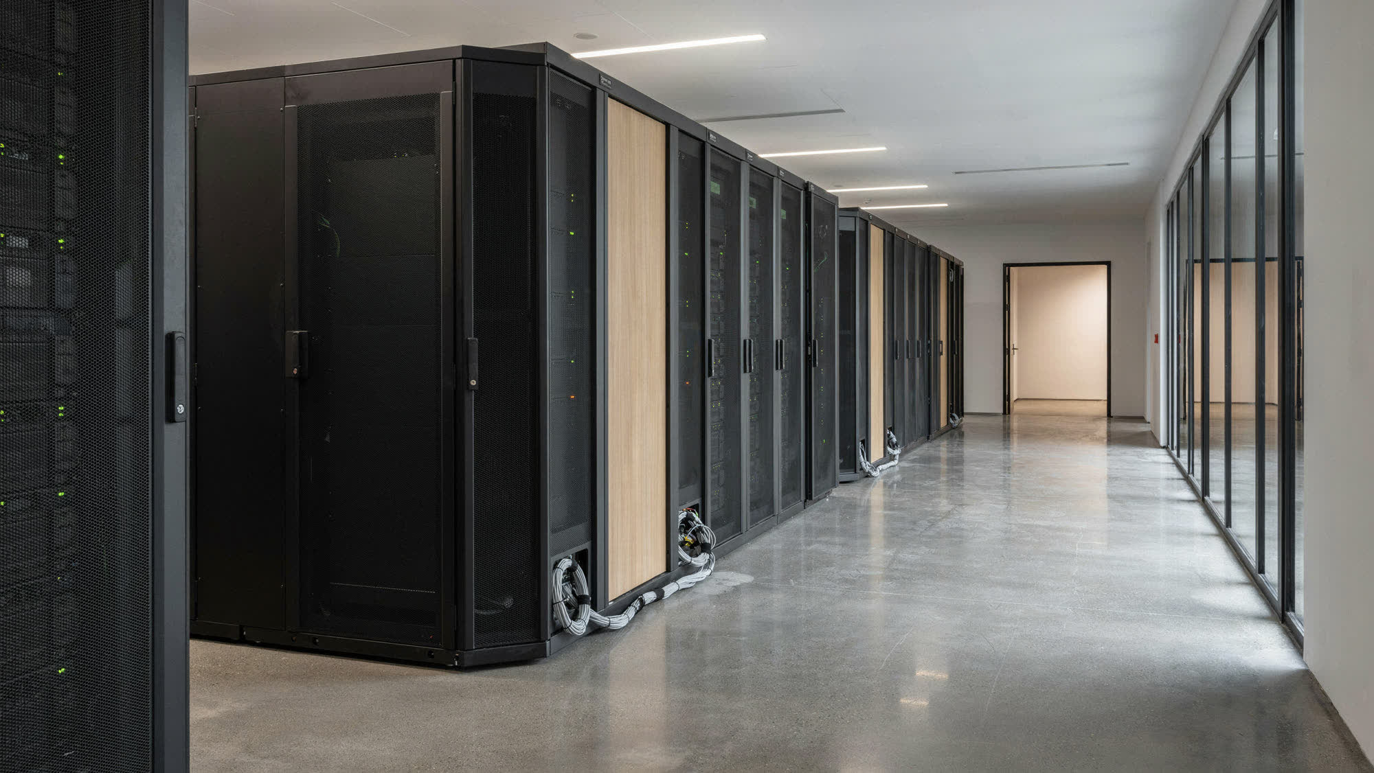 A data center hall with rows of server cabinets