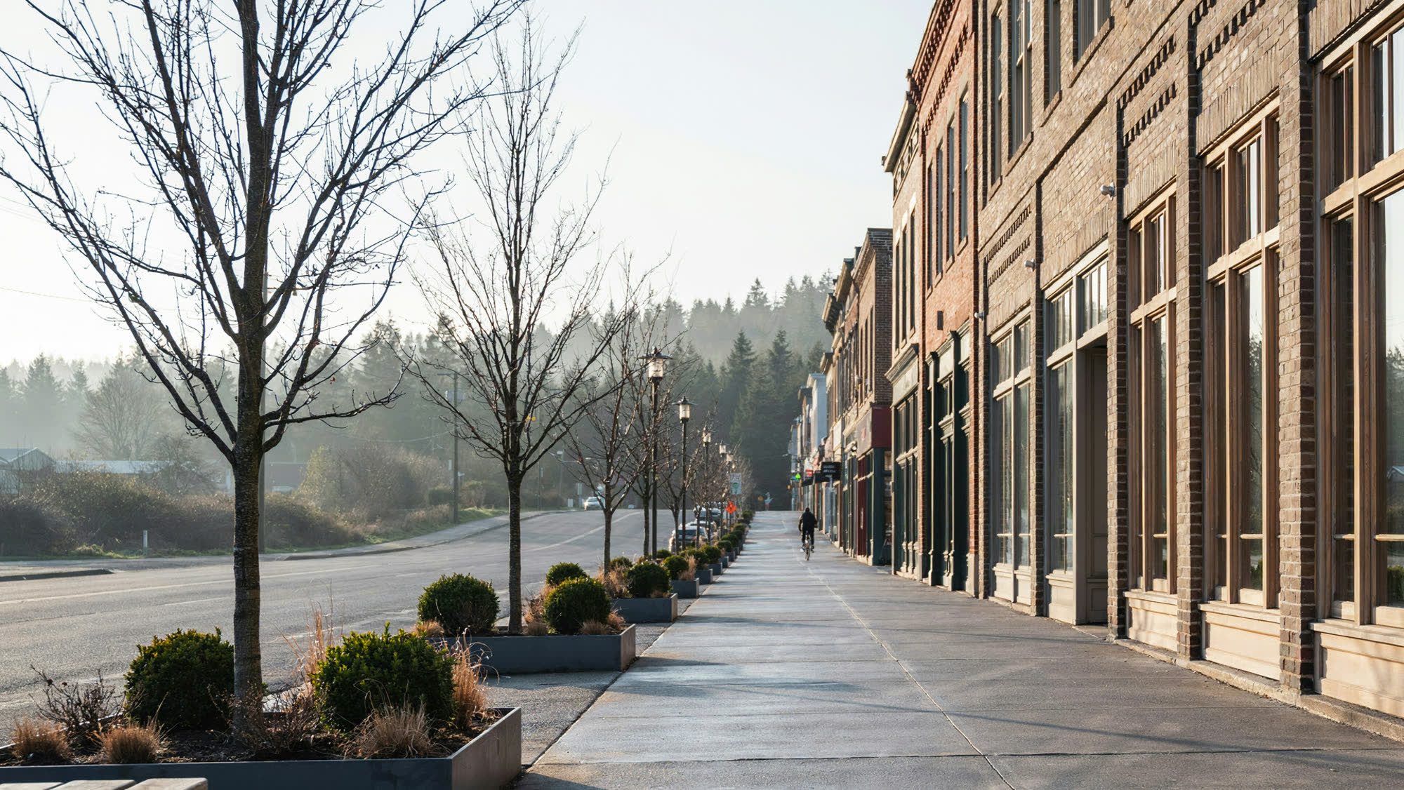A small-town commercial main street lined with restored brick buildings