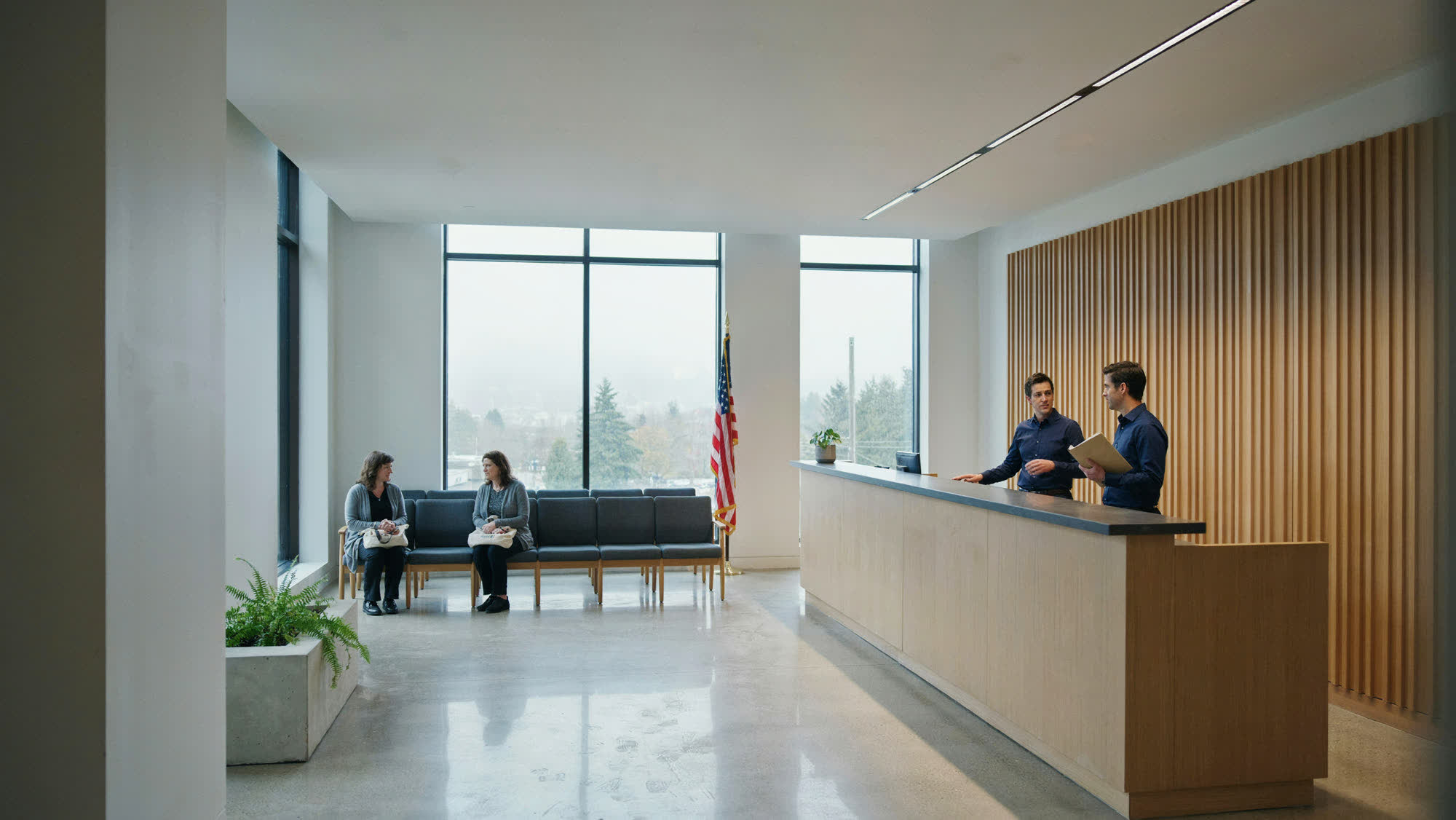 A municipal lobby and public service hall with a reception counter